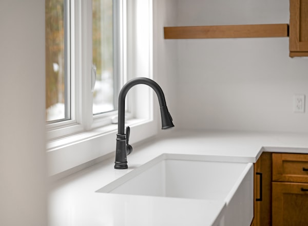 Modern kitchen sink and faucet installation - residential plumbing fixture