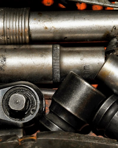Professional plumber at work with tools - representative of Any Plumbing's skilled team